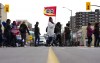 PSAC workers and supporters picket in front of President of the Treasury Board Mona Fortier's office in Ottawa on Friday, April 21, 2023. THE CANADIAN PRESS/Sean Kilpatrick