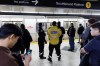 Police officers are seen on the platform as people wait for a subway train inside a TTC station in downtown Toronto, Saturday, April 1, 2023.The Canadian Urban Transit Association is issuing recommendations to improve rider and staff safety, focusing on substance use, mental health, and housing. THE CANADIAN PRESS/Cole Burston