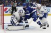 Tampa Bay Lightning's Anthony Cirelli (71) tries to knock the puck loose from Toronto Maple Leafs goaltender Ilya Samsonov (35) as Mark Giordano (55) moves in during the second period in Game 3 of an NHL hockey Stanley Cup first-round playoff series Saturday, April 22, 2023, in Tampa, Fla. It's been 19 long years since the Toronto Maple Leafs last played in the second round of the Stanley Cup playoffs, and that undesirable streak could break tonight. THE CANADIAN PRESS/AP, Chris O'Meara