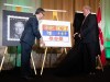 The Royal flag is unveiled by Samy Khalid, left, Chief Herald of Canada at the Canadian Heraldic Authority and Donald Booth, Canadian Secretary to the King during coronation celebrations in honour of King Charles III in Ottawa, on Saturday, May 6, 2023. THE CANADIAN PRESS/Spencer Colby