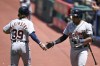 Detroit Tigers' Zach McKinstry (39) celebrates with Andy Ibáñez after scoring on fielder's choice hit by Riley Greene during the first inning of a baseball game against the Cleveland Guardians, Wednesday, May 10, 2023, in Cleveland. (AP Photo/Nick Cammett)