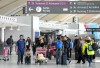 People are shown at Pearson International Airport in Toronto on Friday, March 10, 2023. THE CANADIAN PRESS/Nathan Denette