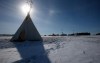 A teepee is shown as Christopher Traverse, Chief of Lake St. Martin First Nation speaks to the media at Winnipeg's Brady Landfill just outside the city, Thursday, April 6, 2023. THE CANADIAN PRESS/John Woods