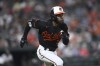 Baltimore Orioles' Cedric Mullins races to third on a triple against the Pittsburgh Pirates during the fifth inning of a baseball game Friday, May 12, 2023, in Baltimore. (AP Photo/Gail Burton)