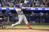 Chicago Cubs' Seiya Suzuki hits a sacrifice fly to center that drove in Dansby Swanson for a run against the Minnesota Twins during the fourth inning of a baseball game, Friday, May 12, 2023, in Minneapolis. (AP Photo/Craig Lassig)