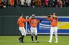Baltimore Orioles left fielder Austin Hays, left, center fielder Cedric Mullins (31) and right fielder Anthony Santander (25) celebrate the team's 2-0 win in a baseball game against the Pittsburgh Pirates at Oriole Park at Camden Yards, Saturday, May 13, 2023, in Baltimore. (AP Photo/Jess Rapfogel)