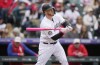 Colorado Rockies' C.J. Cron pops out against Philadelphia Phillies starting pitcher Aaron Nola in the third inning of a baseball game Sunday, May 14, 2023, in Denver. (AP Photo/David Zalubowski)