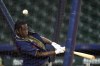 Houston rapper Travis Scott hits during batting practice before a baseball game between the Chicago Cubs and Houston Astros Monday, May 15, 2023, in Houston. (AP Photo/David J. Phillip)