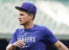 Texas Rangers' Corey Seager, currently on the injured list, jogs on the field during batting practice before a baseball game against the Seattle Mariners, Monday, May 8, 2023, in Seattle. (AP Photo/Lindsey Wasson)