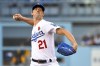 FILE -Los Angeles Dodgers starting pitcher Walker Buehler (21) throws against the Pittsburgh Pirates during the first inning of a baseball game Monday, May 30, 2022, in Los Angeles. Walker Buehler is hoping to return in time for the final month of the Los Angeles Dodgers regular season. His manager is taking a wait-and-see approach. The right-hander threw a modified bullpen session at Dodger Stadium before the game against the Minnesota Twins, Tuesday, May 16, 2023.(AP Photo/John McCoy, File)