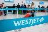 A line at the WestJet counter at the airport in Calgary, Alta., Thursday, May 18, 2023. THE CANADIAN PRESS/Jeff McIntosh