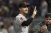 San Francisco Giants' Michael Conforto, left, celebrates after a win over the Minnesota Twins in a baseball game Monday, May 22, 2023, in Minneapolis. (AP Photo/Bruce Kluckhohn)