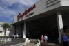 People walk by the entrance of the Tropicana Las Vegas, Tuesday, May 16, 2023, in Las Vegas. Nevada Gov. Joe Lombardo announced Wednesday, May 24, 2023, a tentative agreement between his office, legislative leaders in the state and the Oakland Athletics for a baseball stadium funding plan after weeks of negotiations over how much public assistance the state will contribute to a $1.5 billion ballpark in Las Vegas, according to a joint statement. The bill comes on the heels of the Athletics’ purchase of land on the southern end of the Las Vegas Strip where the Tropicana Las Vegas casino resort sits. (AP Photo/John Locher)