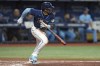 Tampa Bay Rays' Wander Franco heads to first base after hitting an RBI single off Toronto Blue Jays starting pitcher Yusei Kikuchi during the fourth inning of a baseball game Wednesday, May 24, 2023, in St. Petersburg, Fla. Rays' Manuel Margot scored on the hit. (AP Photo/Chris O'Meara)