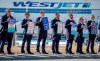 WestJet pilots are poised to get a 24 per cent pay bump over four years under an agreement-in-principle between the company and the union. Members of the Air Line Pilots Association demonstrate amid contract negotiations outside the WestJet headquarters in Calgary, Alta., Friday, March 31, 2023.THE CANADIAN PRESS/Jeff McIntosh