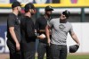 Chicago White Sox pitcher Liam Hendriks, right, laughs with teammates before a baseball game against the Los Angeles Angels, Monday, May 29, 2023, in Chicago. The White Sox returned Hendriks from his injury rehabilitation assignment with Triple-A Charlotte and reinstated him from the 15-day injured list Monday. (AP Photo/Charles Rex Arbogast)