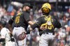 Pittsburgh Pirates relief pitcher Yohan Ramirez, left, is congratulated by catcher Austin Hedges (18) after the team's 9-4 victory over the San Francisco Giants in a baseball game in San Francisco, Wednesday, May 31, 2023. (AP Photo/Tony Avelar)