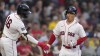 Boston Red Sox's Masataka Yoshida is congratulated by Jarren Duran (16) after Yoshida's solo home run during the second inning of the team's baseball game against the Cincinnati Reds at Fenway Park, Wednesday, May 31, 2023, in Boston. (AP Photo/Charles Krupa)