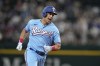 Texas Rangers' Nathaniel Lowe sprints home to score on a Adolis Garcia double in the third inning of a baseball game against the Seattle Mariners, Sunday, June 4, 2023, in Arlington, Texas. (AP Photo/Tony Gutierrez)