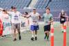 JOHN WOODS / WINNIPEG FREE PRESS
                                Rick Bochinski, 55, with his dad, 81-year-old Garry, and son Michael, 25, finish their run together in the 45th Manitoba Marathon Sunday.