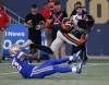John Woods / THE CANADIAN PRESS
                                B.C. Lions&rsquo; Alexander Hollins avoids a tackle by Winnipeg Blue Bombers Desmond Lawrence Thursday night at IG field.