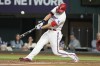 Texas Rangers' Corey Seager (5) hits a double against the St. Louis Cardinals during the seventh inning of a baseball game, Wednesday, June 7, 2023, in Arlington, Texas. (AP Photo/Jim Cowsert)