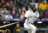 Colorado Rockies' Charlie Blackmon tosses his sheared bat after grounding out against San Diego Padres relief pitcher Tom Cosgrove in the seventh inning of a baseball game Friday, June 9, 2023, in Denver. (AP Photo/David Zalubowski)