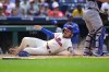 Philadelphia Phillies' Bryson Stott slides safely for a run on a bunt single by Garrett Stubbs during the sixth inning of a baseball game against the Los Angeles Dodgers, Sunday, June 11, 2023, in Philadelphia. (AP Photo/Derik Hamilton)