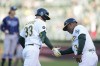 Oakland Athletics' JJ Bleday, left, celebrates with third base coach Eric Martins after hitting a three-run home run against the Tampa Bay Rays during the second inning of a baseball game in Oakland, Calif., Wednesday, June 14, 2023. (AP Photo/Godofredo A. Vásquez)