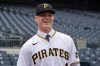 FILE - Henry Davis poses for photos on the field at PNC Park before a baseball game between the Pittsburgh Pirates and the New York Mets in Pittsburgh, July 18, 2021. The Pittsburgh Pirates are calling up heralded prospect Davis, the top pick in the 2021 draft, to help the team that has lost six straight games and tumbled from the top spot in the NL Central. (AP Photo/Gene J. Puskar, File)