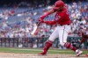 Washington Nationals' Luis Garcia hits a two-RBI single during the second inning of a baseball game against the St. Louis Cardinals at Nationals Park, Monday, June 19, 2023, in Washington. Garcia he tried to squeeze the single into a double but was out on the tag. (AP Photo/Alex Brandon)