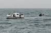 In this photograph released by Action Aviation, the submersible Titan is set to dive into the Atlantic Ocean on an expedition to the Titanic on Sunday, June 18, 2023. An air and sea search continues today in the remote area of ocean south of Newfoundland for a submersible carrying five people that went missing during a dive on the wreckage of the Titanic. THE CANADIAN PRESS/AP-Action Aviation via AP