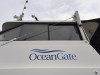The logo for OceanGate Expeditions is seen on a boat parked near the offices of the company at a marine industrial warehouse office door in Everett, Wash., Tuesday, June 20, 2023. Rescuers raced against time to find the missing submersible carrying five people, who were reported overdue Sunday night. (AP Photo/Ed Komenda)