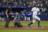 Toronto Blue Jays designated hitter Brandon Belt (13) hits a solo home run against the Houston Astros in sixth inning American League MLB baseball action in Toronto on Wednesday, June 7, 2023. Belt has been reinstated from the 10-day injured list by the Blue Jays. THE CANADIAN PRESS/Andrew Lahodynskyj
