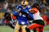 Winnipeg Blue Bombers' Drew Wolitarsky (82) gets tackled by BC Lions' T.J. Lee (6) and Jordan Williams (21) during the second half of CFL western final action in Winnipeg, Sunday, Nov. 13, 2022.&nbsp;Wolitarsky is confident the Blue Bombers won’t be shut out by the visiting B.C. Lions on Thursday. THE CANADIAN PRESS/John Woods