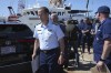 U.S. Coast Guard Rear Adm. John Mauger, commander of the First Coast Guard District, left, steps away from the media at the conclusion of a news conference, Thursday, June 22, 2023, at Coast Guard Base Boston in Boston. The missing submersible Titan imploded near the wreckage of the Titanic, killing all five people on board, according to the U.S. Coast Guard. (AP Photo/Steven Senne)