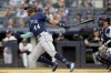 Seattle Mariners' Julio Rodriguez hits a single off New York Yankees starting pitcher Jhony Brito in the first inning of a baseball game, Wednesday, June 21, 2023, in New York. (AP Photo/John Minchillo)