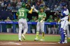 Oakland Athletics JJ Bleday (33) celebrates his two-run home run against the Toronto Blue Jays with Tony Kemp (5) during first inning MLB baseball action in Toronto on Friday, June 23, 2023. THE CANADIAN PRESS/Christopher Katsarov
