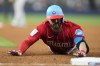 Miami Marlins' Jon Berti slides safely back to first after hitting a single during the fifth inning of a baseball game against the Pittsburgh Pirates, Saturday, June 24, 2023, in Miami. (AP Photo/Lynne Sladky)