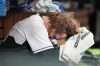 Colorado Rockies relief pitcher Noah Davis sits in the dugout after retiring the top of the sixth inning against the Los Angeles Angels in a baseball game Saturday, June 24, 2023, in Denver. (AP Photo/David Zalubowski)