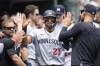 Minnesota Twins' Royce Lewis (23) celebrates scoring on a Detroit Tigers third baseman Nick Maton throwing error in the eighth inning of a baseball game, Sunday, June 25, 2023, in Detroit. (AP Photo/Paul Sancya)