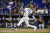 Miami Marlins' Jesus Sanchez flies out to center field during the first inning of a baseball game against the Pittsburgh Pirates, Sunday, June 25, 2023, in Miami. (AP Photo/Michael Laughlin)