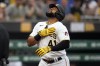 Pittsburgh Pirates' Carlos Santana crosses home plate after hitting a two-run home run off San Diego Padres starting pitcher Blake Snell during the first inning of a baseball game in Pittsburgh, Wednesday, June 28, 2023. (AP Photo/Gene J. Puskar)