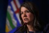 Alberta Premier Danielle Smith responds to a question during a news conference after a meeting of western premiers, in Whistler, B.C., on Tuesday, June 27, 2023. CBC News is retracting a report from January alleging someone in Premier Danielle Smith’s office emailed prosecutors to question the handling of cases involving a COVID-19 protest at a U.S. bordering crossing. THE CANADIAN PRESS/Darryl Dyck