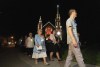 Former mayor Colette Roy-Laroche, left, and current mayor Julie Morin, take part in a silent march to pay tribute to the 47 victims of an oil-filled train derailment that occurred ten years ago, Thursday, July 6, 2023 in Lac Megantic, Que. THE CANADIAN PRESS/Christinne Muschi