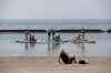 A group of people on paddleboards cool off in Lake Ontario in Toronto on Thursday, July 6, 2023. THE CANADIAN PRESS/Cole Burston
