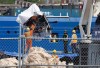 Debris from the Titan submersible, recovered from the ocean floor near the wreck of the Titanic, is unloaded from the ship Horizon Arctic at the Canadian Coast Guard pier in St. John’s on Wednesday, June 28, 2023. The company that operated a submersible that imploded on its way to explore the wreck of the Titanic says it has suspended operations. THE CANADIAN PRESS/Paul Daly