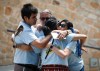 JOHN WOODS / WINNIPEG FREE PRESS
Joseph Fourre, centre, his son Dylan, and his daughter Nicole Labossiere  are comforted by a supporter at a Fentanyl Awareness Walk and rally at Oodeena square. Fourre’s son Harlan Fourre, and ex-wife, Miranda Paupaneks, died of fentanyl overdoses.