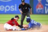 Kansas City Royals' Maikel Garcia is caught stealing second base by Cleveland Guardians' Andrés Giménez during the seventh inning of a baseball game, Sunday, July 9, 2023, in Cleveland. (AP Photo/Nick Cammett)