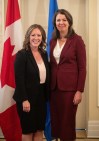 Alberta Premier Danielle Smith and Minister of Environment and Protected Areas Rebecca Schulz stand together during the swearing in of her cabinet, in Edmonton, Alta, Friday, June 9, 2023. Critics say direction from Smith to her new environment minister lacks specifics on climate change and does more to protect industry interests than ecosystems. THE CANADIAN PRESS/Jason Franson.
